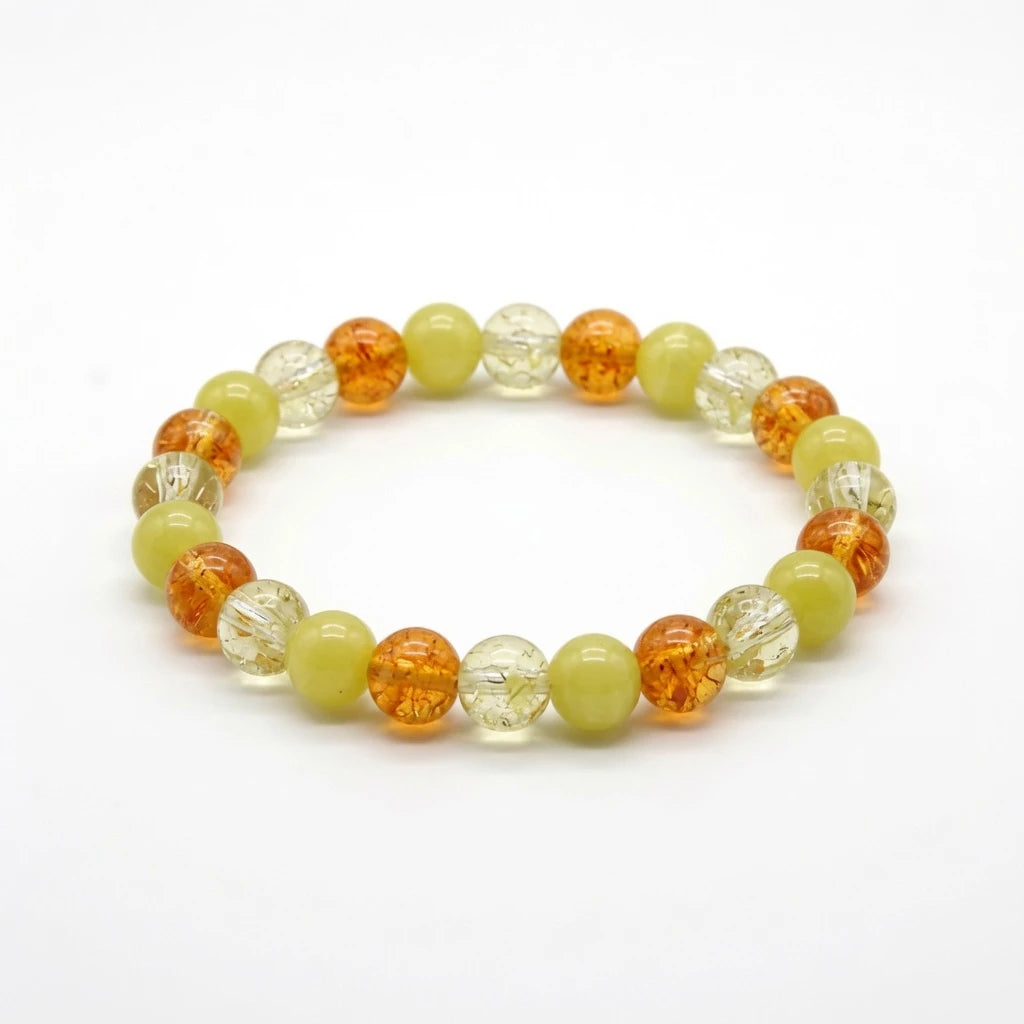 Sunny citrine and yellow jade beaded bracelet in warm amber tones, flat lay