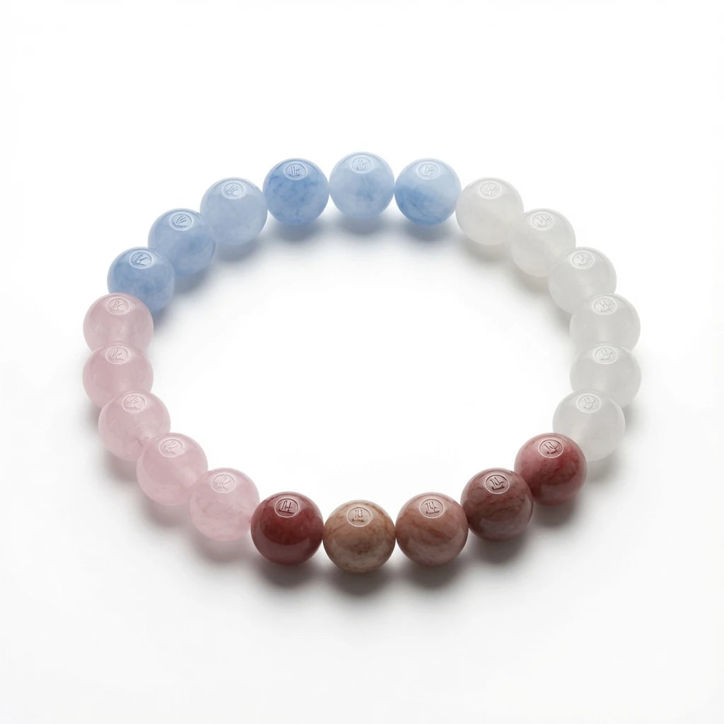 Moonstone, aquamarine, rose quartz and strawberry quartz beaded bracelet in pastel tones, flat lay