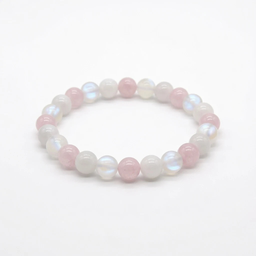 Rose quartz and moonstone beaded bracelet in soft pink and pearl, flat lay