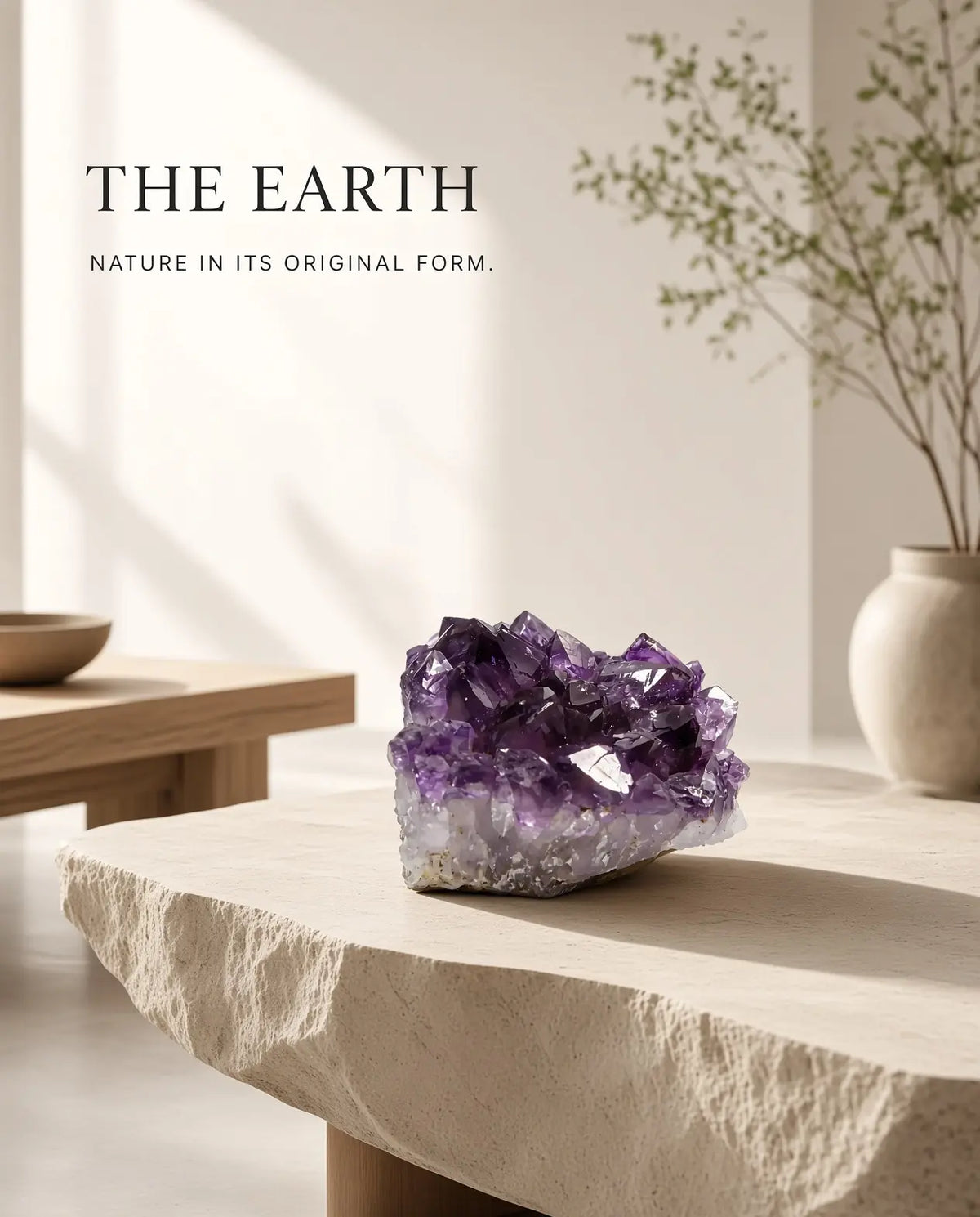 Amethyst crystal cluster on a stone table with “The Earth” brand text