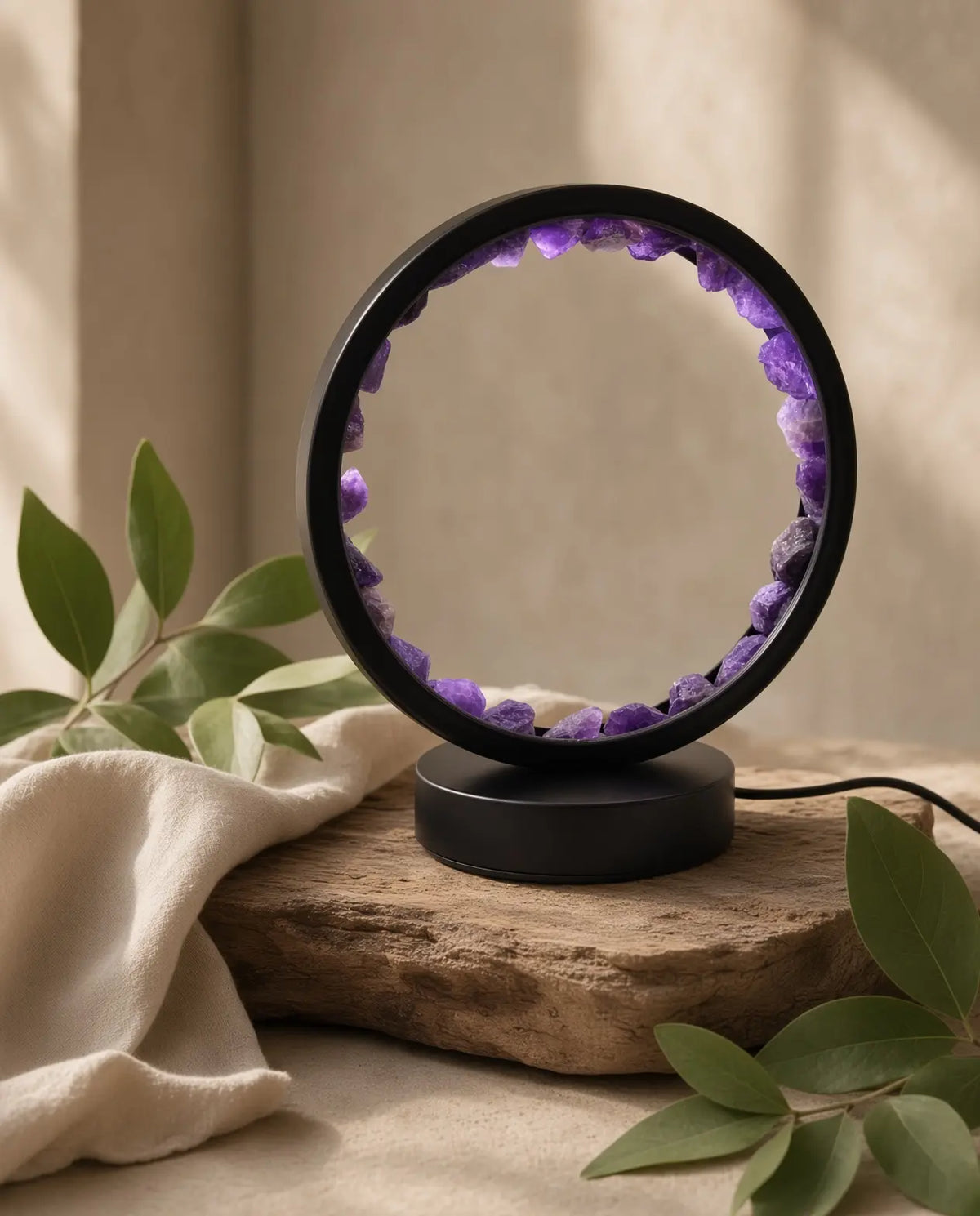 Amethyst glow lamp styled with linen and greenery