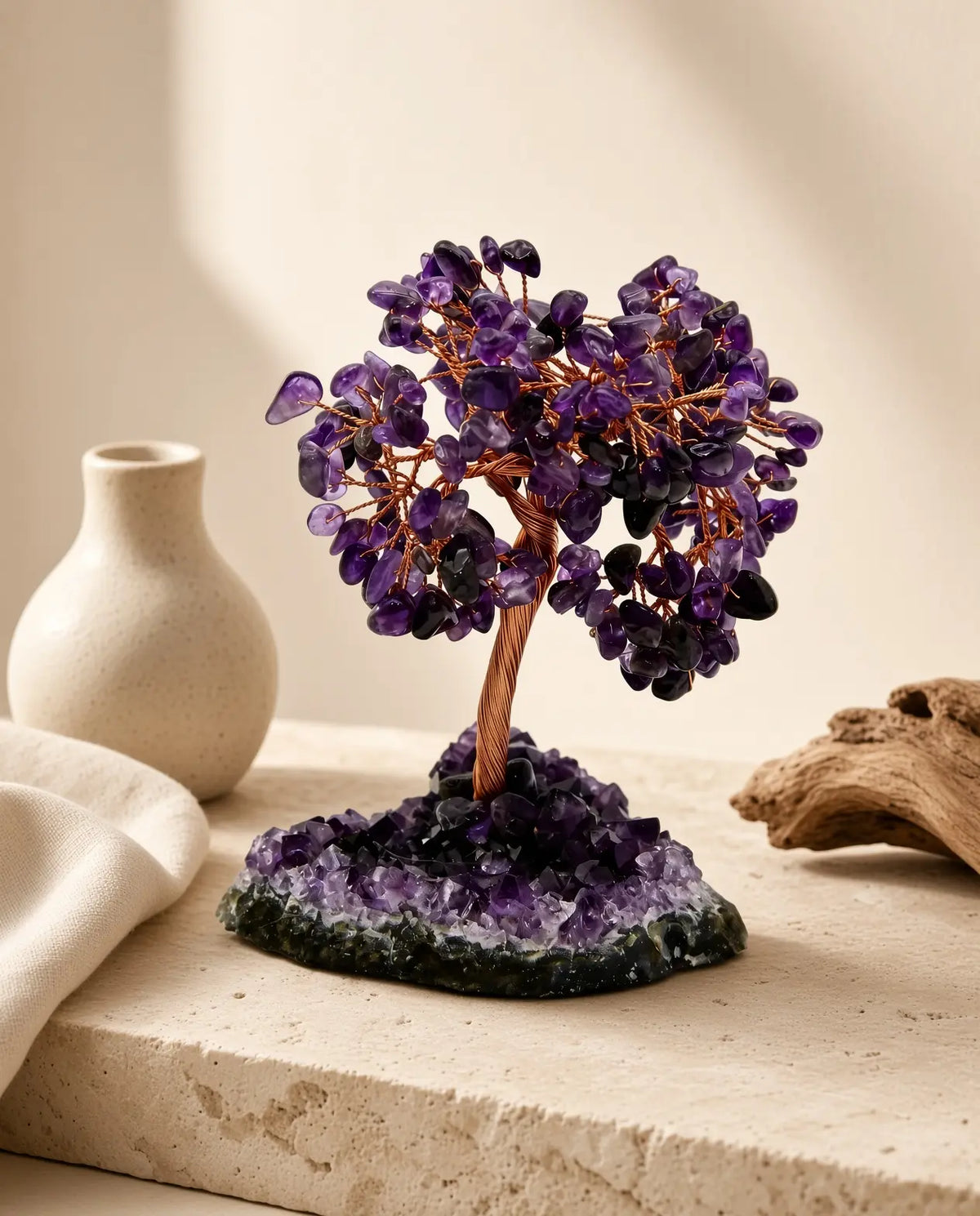 Amethyst crystal tree on geode base styled with natural home decor