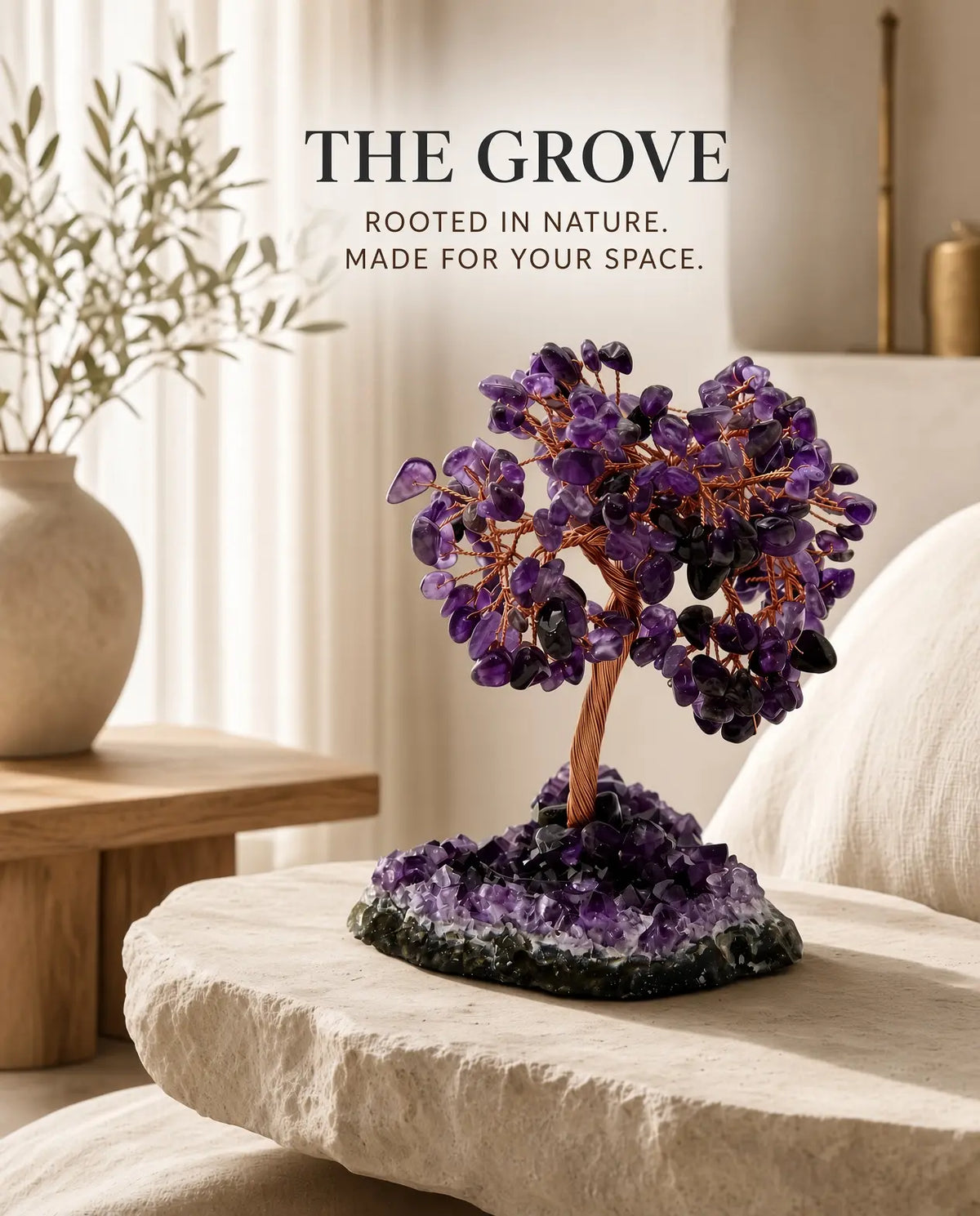 Amethyst crystal tree on a stone table with brand text “The Grove”