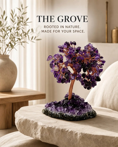 Amethyst crystal tree on a stone table with brand text “The Grove”