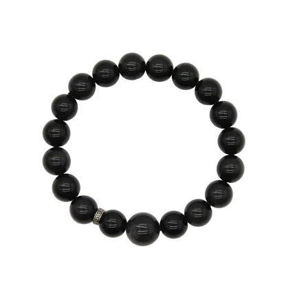 Natural black obsidian polished bead bracelet with deep glossy 10mm round stones and sterling silver key-pattern spacer, protection and grounding crystal jewelry on white background