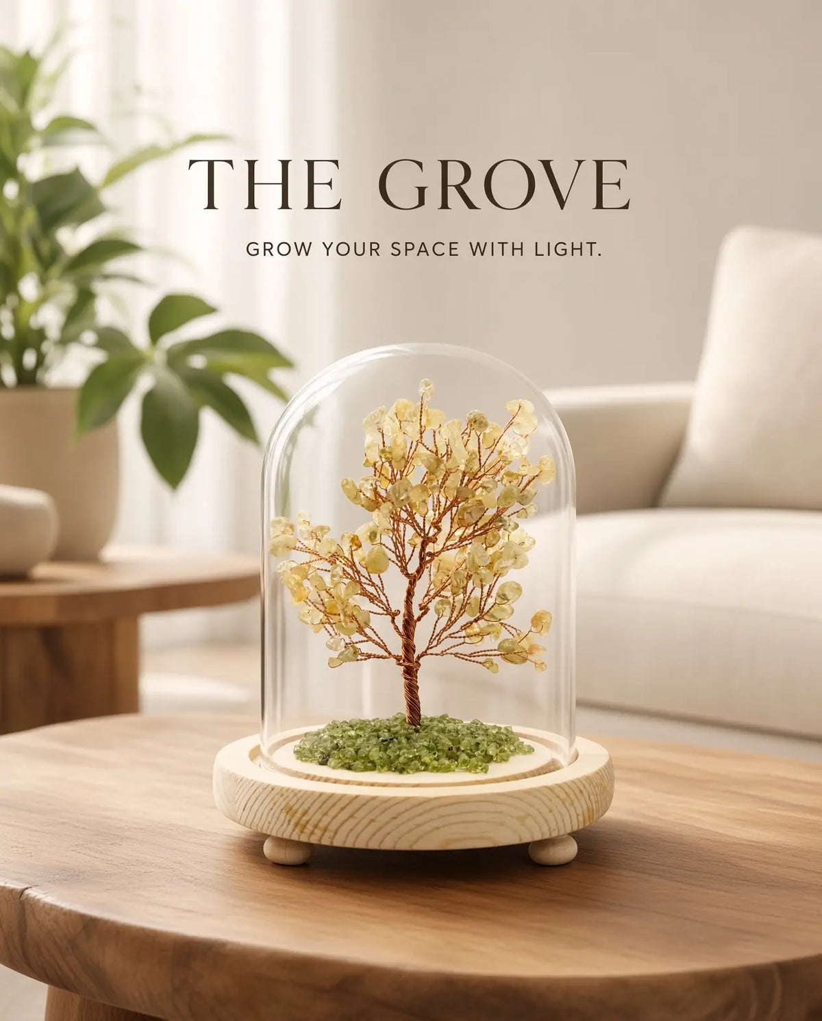 Citrine glow tree on a coffee table with “The Grove” brand text