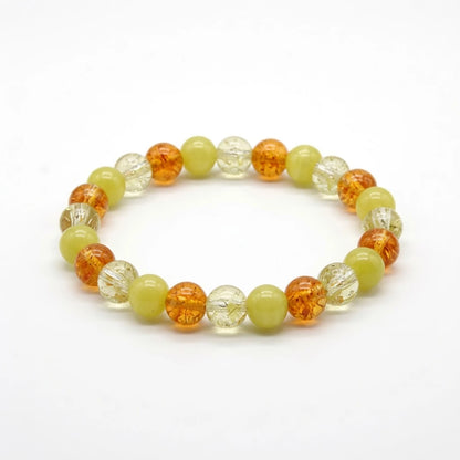 Sunny citrine and yellow jade beaded bracelet in warm amber tones, flat lay