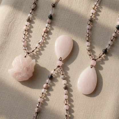 Rose quartz beaded necklace showing hand-knotted strand and length