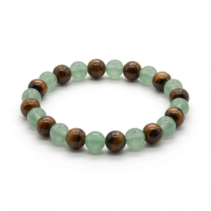 Green aventurine and tiger's eye beaded bracelet in green and amber tones, flat lay