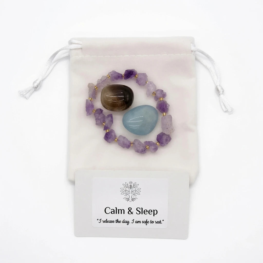Amethyst bracelet and tumbled smoky quartz and aquamarine stones placed on nightstand beside candle for bedtime crystal ritual, healing crystals for sleep and relaxation