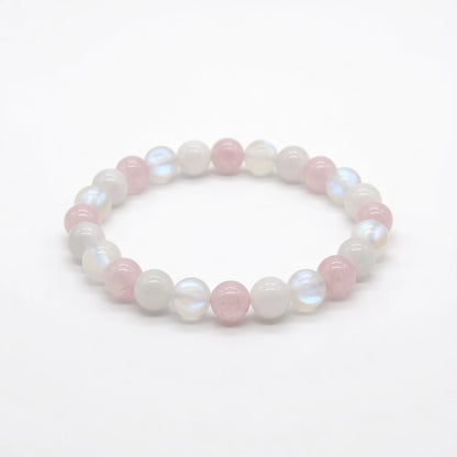 Rose quartz and moonstone beaded bracelet in soft pink and pearl, flat lay