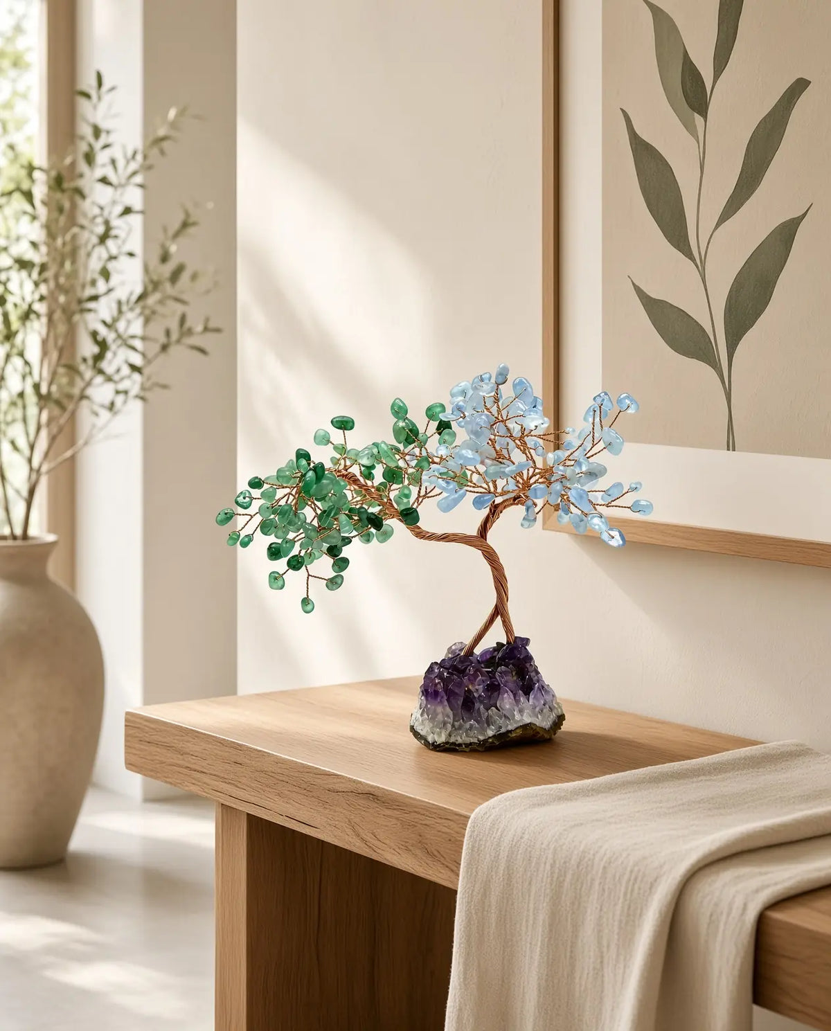 Rose quartz and aquamarine crystal tree on a living room side table