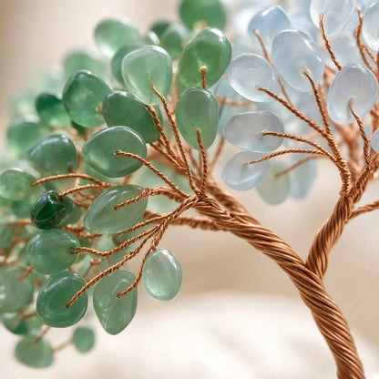 Detail of rose quartz and aquamarine chips on copper wire branches