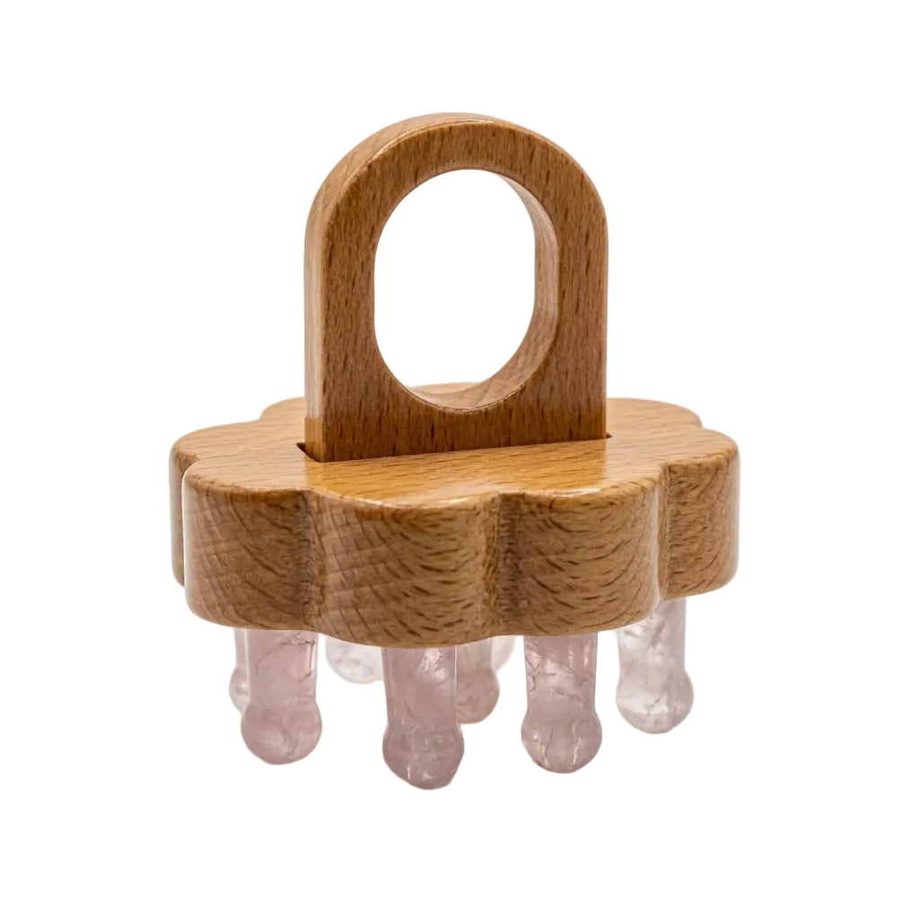 Natural rose quartz crystal bead scalp massager comb with beechwood handle, pink stone teeth on wooden base, beauty massage tool on white background
