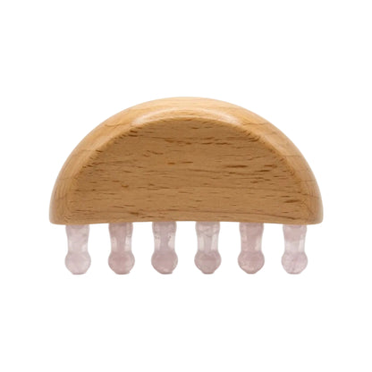 Natural rose quartz wide-tooth scalp gua sha comb with beechwood half-dome base and six pale pink crystal teeth, hair growth massage tool on white background