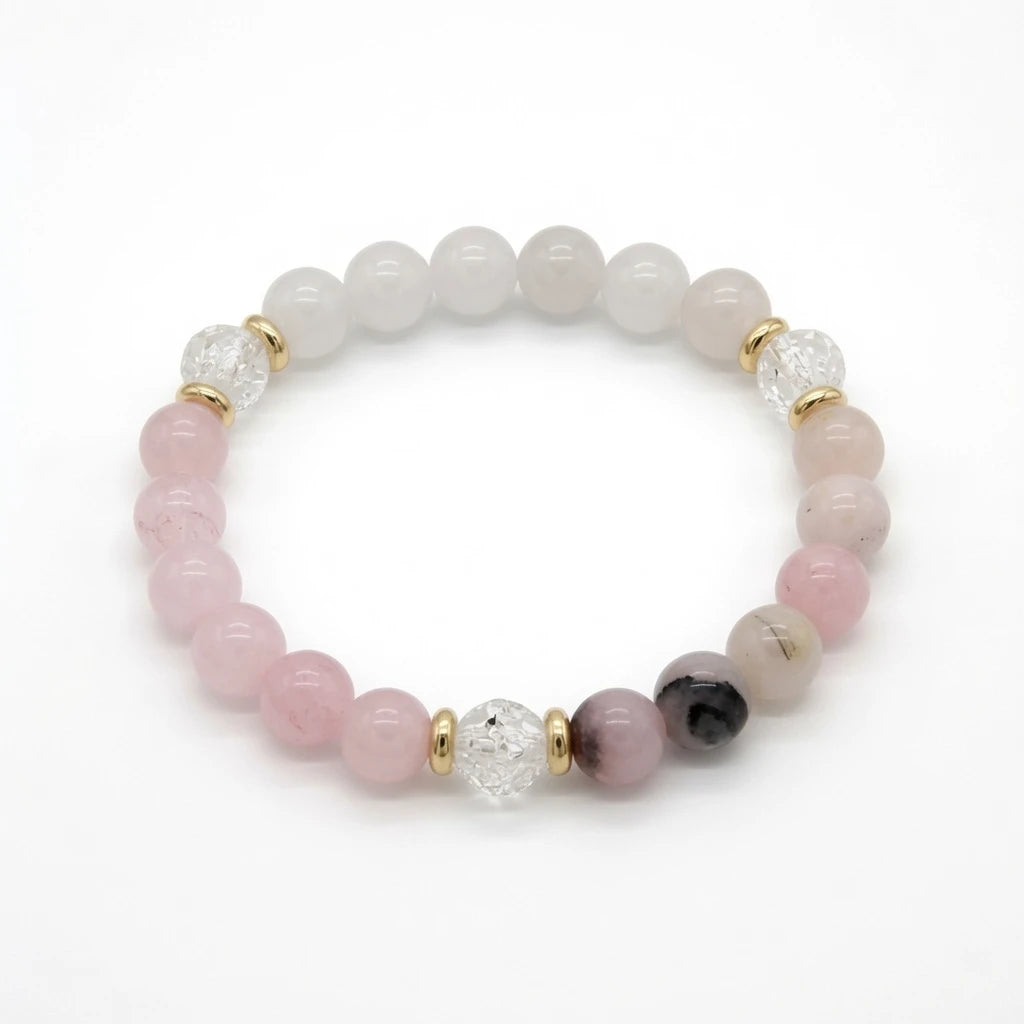 Rose quartz and clear quartz beaded bracelet in soft pink with gold spacers, flat lay