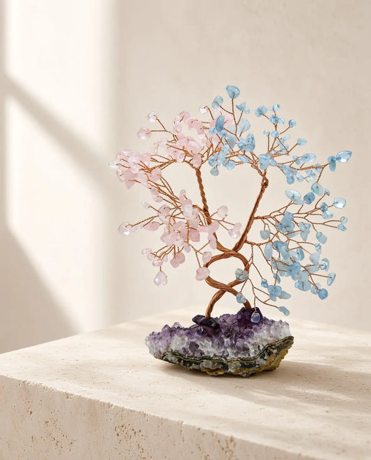 Rose quartz and aquamarine crystal tree on amethyst base displayed on stone