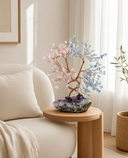 Rose quartz and aquamarine crystal tree on a living room side table