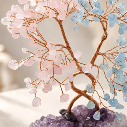 Detail of rose quartz and aquamarine chips on copper wire branches