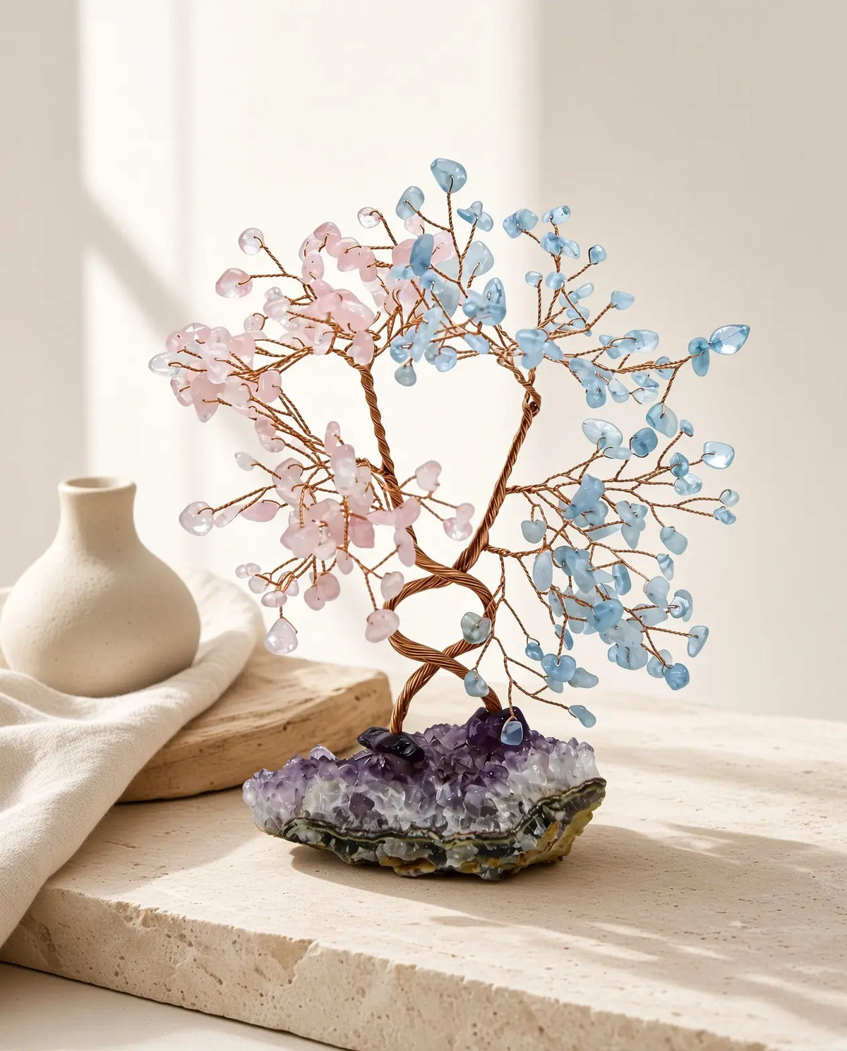Rose quartz and aquamarine crystal tree styled with natural home decor
