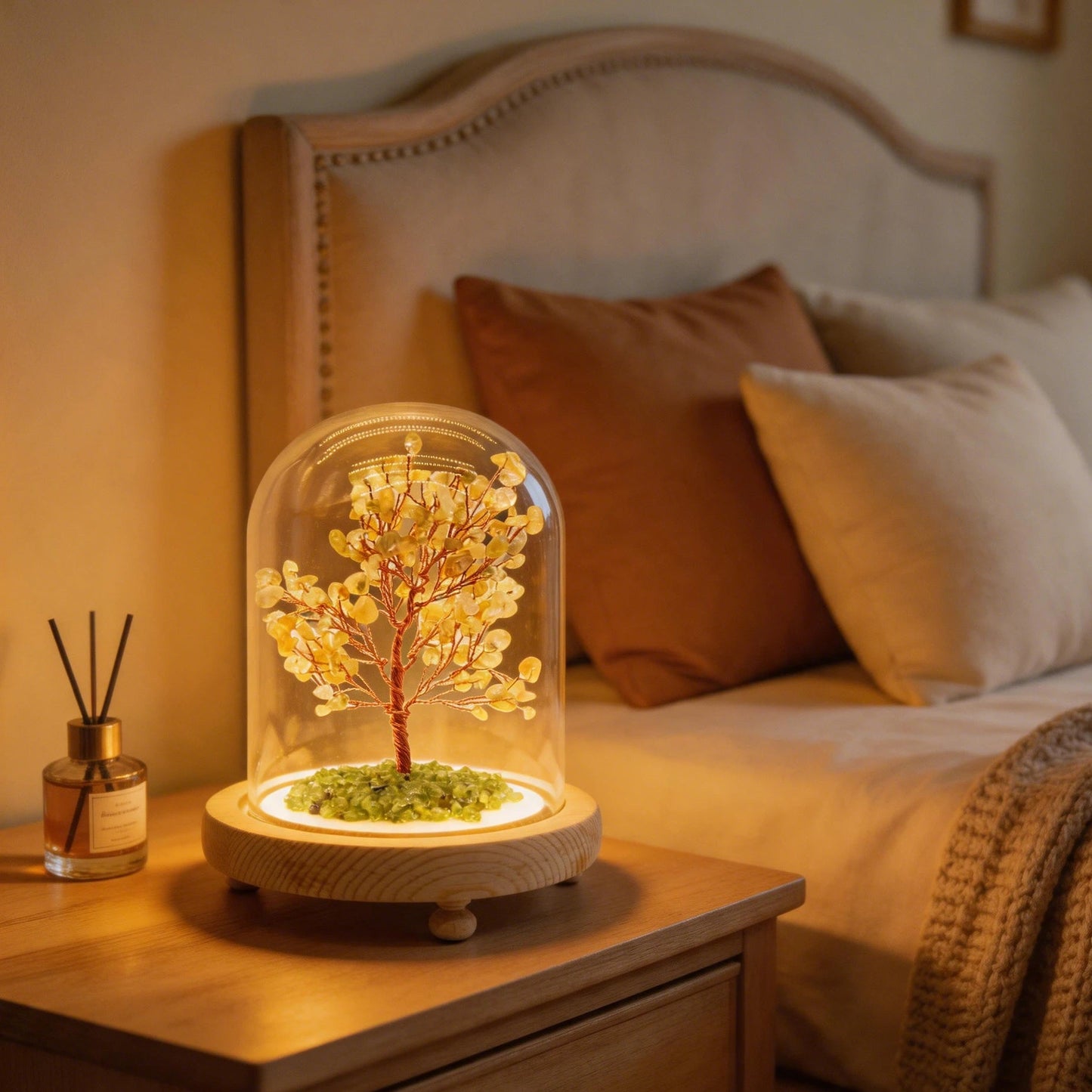 Citrine crystal tree night light with glass dome, soft warm light, natural citrine and peridot stones for wealth manifestation.