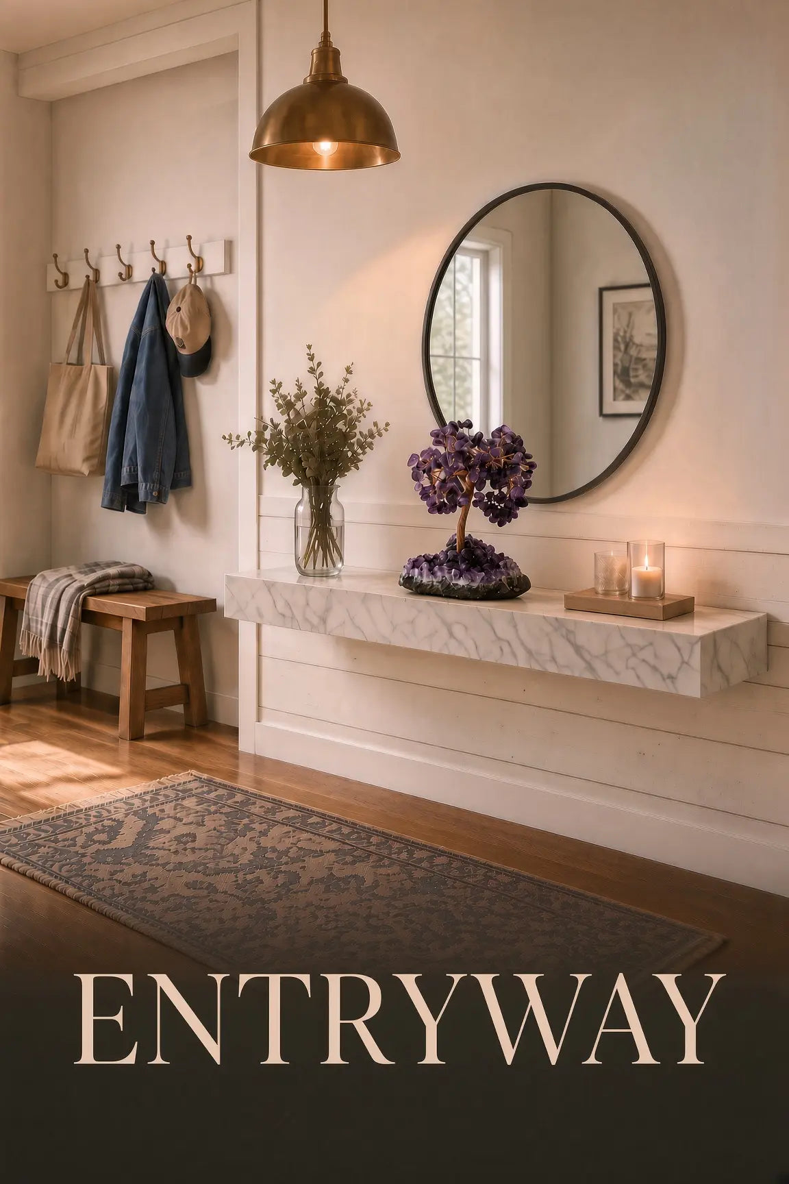Welcoming entryway featuring an amethyst crystal tree on a marble console under warm pendant lighting